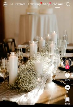 the table is set with candles and flowers