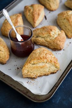 biscuits and jam are on a baking sheet