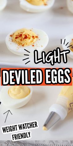 light deviled eggs on a tray with an egg in the middle