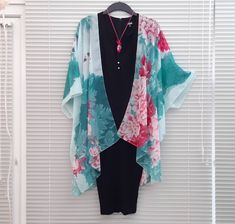 "This versatile kimono cardigan can be worn as a beach cover-up or with a  dress or camisole. Suitable for daywear or eveningwear, the perfect addition to any wardrobe.  Ideal for holidays and travelling, even backpacking as it takes up nearly no room in your travel bag and is light. - Floral Kimono Cardigan  - Wide Sleeves - Draping perfectly - Light weight sheer soft fabric - One size fits most - Floaty fabric - Light and breathable - V neck style at the back *Please note the dress/camisole is Free Size V-neck Kimono For Spring, Green V-neck Kimono For Summer, Summer Green Open Front Kimono, Green Open Front Summer Kimono, Green Open Front Kimono For Summer, Green Open Front Kimono For Beach Cover-up, Green Open Front Kimono For Beach, Summer Open Front Kimono For Daywear, Green Free Size Summer Kimono