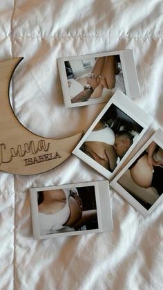 four polaroid photos are placed next to a crescent moon on a white bed sheet