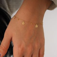 "The charm of a star shaped on the minimalist chain! This minimalist 14K solid gold star bracelet is ultra -light and comfortable thanks to the manufacture of plate cutting. This bracelet makes a great gift for every situation. Suitable for daily use. A perfect jewel selection for those who prefer a minimal and elegant style. Find out more about my shop at: https://etsy.me/3M2bjEd   PRODUCT DETAILS    * Material: 14K Solid Gold (real solid gold, no gold-filled or no gold plated material)  * Choi Gold Aesthetic Bracelet, Chain Bracelet With Charms, Star Bracelet Gold, Gold Star Accessories, Gold Bracelet With Charms, Elegant Charm Bracelet, Minimalist Bracelet Gold, Dainty Gold Charm Bracelet, Hand Bracelet Gold For Women