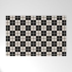 a black and white checkerboard pattern on a wall