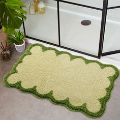 a bathroom with a green rug on the floor