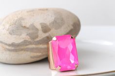 PINK FUCHSIA RING, Statement Pink Stone Ring, Hot Pink Ring, Large Unique Ring, Big Stone Cocktail Ring, Neon Ring, Dark Pink Chunky Ring Details of ring: Metal: Gold or Silver  or silver Antique plated or rose gold in finish over brass with nickel free Size of stone is 20*30 mm Gemstone: crystals Adjustable ring band width is: 30 mm The ring will be packed in a gift box. Details of the earrings: Metal: Gold or Silver or silver Antique plated rose gold in finish over brass with nickel free Size: 25*30 mm Gemstone: crystal The earrings will be packed in a gift box. FOR MY RINGS COLLECTION: https://www.etsy.com/il-en/shop/rebekajewelry?ref=hdr_shop_menu§ion_id=14282915 TO GET TO MY ETSY SHOP: https://www.etsy.com/il-en/shop/rebekajewelry THANK YOU CHOOSING MY ETSY SHOP REBEKA Neon Ring, Pink Stone Ring, Pink Stone Rings, Chunky Ring, Antique Plates, Personalized Gift Wrap, Earrings Metal, Chunky Rings, Unique Ring