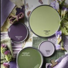 several shades of green and purple on a table