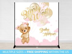 a baby shower sign with balloons and a teddy bear