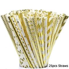 gold and white paper straws are lined up