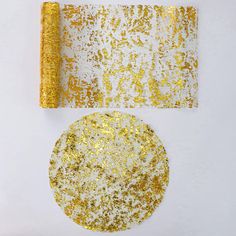 two pieces of gold glitter next to each other