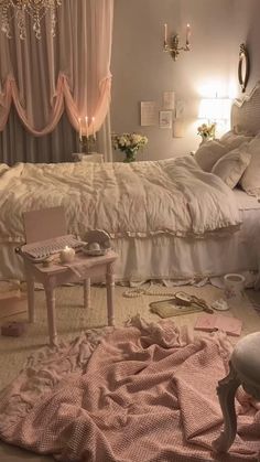 a bed room with a neatly made bed and chandelier