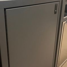 an office cubicle with metal doors and drawers