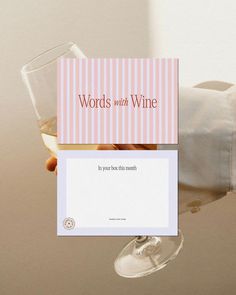 there is a card with words on it and a wine glass next to it that says words with wine