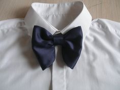 "Oversized Bow Tie in Navy Blue Satin. Pre-tied and adjustable. Bow tie size - Width: 12 cm /4,7\" | Height: 10 cm / 3.93'' The adjustable strap takes it to 21\" in length, making it a great accessory that can be adjusted for comfort and fit or given as a gift if you are unsure of neck size. Perfect for formal or causal use. **bowties are shipped in a small shipping box to keep them from being damaged**" Blue Bow With Butterfly Knot For Wedding, Blue Wedding Bow With Butterfly Knot, Tuxedo Bow Tie With Decorative Bow For Wedding, Dapper Bow Tie With Detachable Bow For Weddings, Tuxedo Bow Tie With Detachable Bow For Wedding, Tuxedo Style Wedding Bow Tie With Detachable Bow, Dapper Wedding Bow Tie With Detachable Bow, Wedding Tuxedo Bow Tie With Detachable Bow, Detachable Bow Tuxedo Bow Tie For Wedding