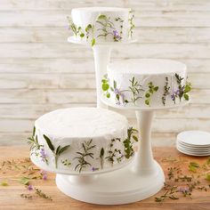 three tiered cake stands with flowers painted on them