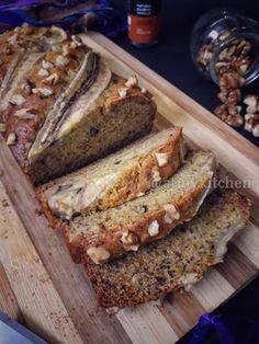 sliced loaf of banana nut bread on a cutting board