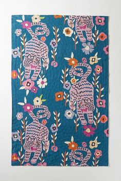 an elephant and flowers pattern on a blue background