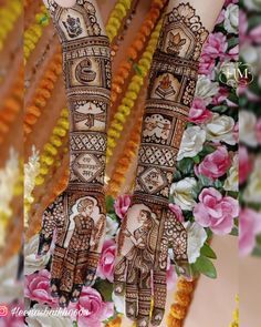 two hands decorated with henna and flowers