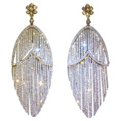 The Following Items we are offering is a Rare Important Radiant 18KT Gold Glamorous and Elaborate Rare Magnificent Glittering Diamond Fringe Design Earrings. Earrings feature OVER 14,000 RARE HANDSET SPARKLING DIAMONDS set in 18KT GOLD! T.C.W. Approx 15CTS!! These Gorgeous Pair of Earrings are a Rare Sample Pair from a Top Private Manufacturer that sold to Important Five Star Hotel and Fine Jewelry Stores!!! New with Tags $18,000. A Pair of Magnificent Masterpieces!! Rose Gold Chandelier Earrings, Conch Pearl, Diamond Chandelier Earrings, Diamond Chandelier, White Diamond Earrings, Gold Chandelier Earrings, Glitter Earrings, Five Star Hotel, Design Earrings