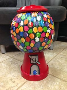 a brightly colored gummy ball machine sitting on the floor