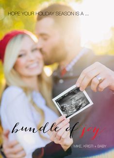 a man and woman holding up an old photo with the words bundle of joy on it