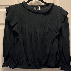 Perfect Condition- Nwot Lightweight Cotton - Blousy Fit But Not Oversized. Size S Ruffles All Around Collar And Down Shoulders- Front And Back With Beautiful Flattering Seams Down Front And Back. Elastic Sleeve Cuff With Ruffles And Elasticized Bottoms Black Casual Top With Ruffled Collar, Black Pleated Top For Fall, Free People Tops, Ruffles, Free People, Long Sleeve Tees, Collar, Long Sleeve, Women Shopping