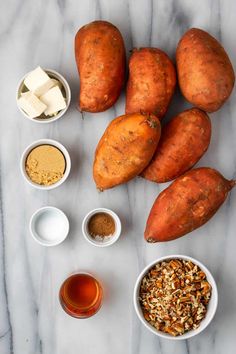 sweet potatoes and other ingredients laid out on a marble surface