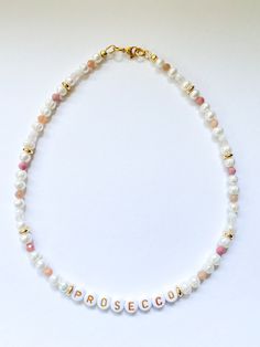 One of a kind freshwater pearl choker with colorful gemstone beads. Your good mood necklace to wear everyday - fun and youthful! 〔 𝐃 𝐞 𝐬 𝐜 𝐫 𝐢 𝐩 𝐭 𝐢 𝐨 𝐧 & 𝐒 𝐢 𝐳 𝐞 〕 White freshwater pearls, gold plated beads, glass beads and various gemstone beads, acrylic letter beads. Necklace size is 15.5 inches 39.5cm). 〔 𝐏 𝐚 𝐜 𝐤 𝐚 𝐠 𝐢 𝐧 𝐠 & 𝐒 𝐡 𝐢 𝐩 𝐩 𝐢 𝐧 𝐠 〕 It takes 1 to 2 days to prepare your order for shipping. All packages are shipped by local post service. Your jewelry w Mood Necklace, Multicolor Pearl Necklace, Gemstone Choker Necklace, Y2k Necklace, Gemstone Choker, Necklace Colorful, Pink Y2k, Letter Beads, White Freshwater Pearl