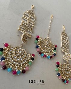 A gorgeous earrings and tikka set with ear chains (sahara) to instantly elevate your look. Eid Party Tikka With Latkans, Bohemian Stone Work Tikka For Festivals, Bohemian Festival Stone Work Tikka, Bohemian Gold Sets For Eid, Elegant Multicolor Sets With Latkans, Bohemian Kundan Tikka For Diwali, Festive Multicolor Danglers For Eid, Festive Tikka With Matching Earrings, Bollywood Chandbali Tikka With Motifs