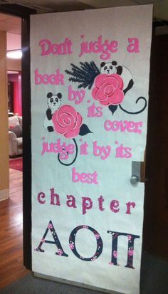 a door decorated with pink flowers and pandas on it, says don't judge a book by its cover just by its best charter