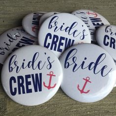 six brides crew buttons on a wooden table