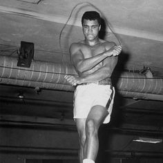 a man standing on top of a wrestling ring