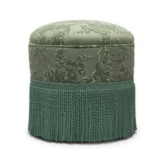 a green and white ottoman sitting on top of a table