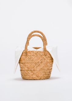 Our Mini Sur straw tote is a modern staple that will work with anything in your wardrobe. Customize it with a liner or playful pom poms for a tote that's uniquely yours. Handbag accessories sold separately here. Handcrafted from all-natural woven straw using a time-honored Filipino basketweaving technique. Measures 9" W by 6.5" H by 6"D with a 4.25" handle drop. *Bag sold without liner. San Francisco Shopping, Button Headband, Alphabet Charm, Basket Style, Straw Clutch, Straw Tote, St Tropez, Sandals For Sale, Mini Tote