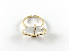 These imitation clear quartz rock rings are real gold 18k plated with a brass base. They are unique and beautiful. Definitely would catch everyone's eyes! Material: Real gold 18k plated with brass base, Imitation Clear Quartz Size: Adjustable Quantity: 1 piece for $4.49; 5 pieces for $16.49 These rings are slow tarnish and are suitable for everyday wear. For longer lasting, please avoid contact with perfumes, body oils, and other chemicals, including household cleaners. Gold Brass Crystal Ring With Gemstone, Gold Crystal Ring With Large Stone For Promise, Adjustable Gold Crystal Ring, Modern Style, Modern Gold Crystal Ring, Adjustable Gold Crystal Ring With Large Stone, Unique Gold Crystal Ring With Large Stone, Adjustable Gold Crystal Ring With Gemstone, Adjustable Gold Crystal Gemstone Ring, Modern Gold Crystal Ring With Gemstone