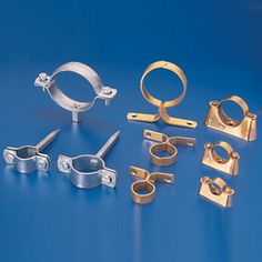 an assortment of metal objects on a blue background