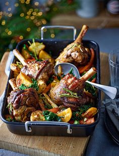 a roasting pan filled with meat and vegetables