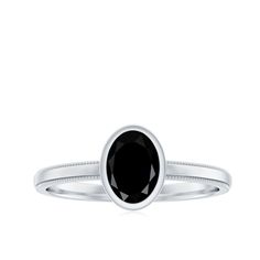 Product Details The Simple Oval Cut Black Onyx Solitaire Ring in a Bezel Setting is a timeless piece of jewelry that exudes elegance and sophistication. This stunning ring features a 6X8 MM oval black onyx center stone in a straight shank type. The sleek and modern design is perfect for everyday wear, while the black onyx gemstone adds a touch of luxury. The bezel setting is a classic and secure way to set the gemstone, ensuring that it will stay in place for years to come. This ring is perfect Classic Oval Black Spinel Jewelry, Classic Black Rings For Anniversary, Elegant Black Oval Ring, Classic Oval Signet Ring With Center Stone, Elegant Oval Black Spinel Rings, Classic Black Spinel Promise Ring, Oval White Gold Jewelry With Black Enamel, Classic Black Spinel Ring For Formal Occasions, Black Oval Cabochon Jewelry For Anniversary