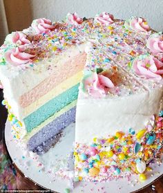 a cake that has been cut into pieces with sprinkles on the side