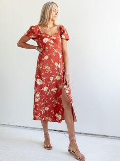 The Janie Floral Dress is a fun fall dress that is perfect for a special occasion or an evening out. Featuring gentle puff sleeves, a structured bodice with seam detailing, and smocking at the back for added comfort. Fit: True to sizeFabric Content: 100% PolyesterFabric Care: Machine Wash Cold Gentle Cycle, lay flat to dryMeasurements: 49" Shoulder to hemLining: Yes 100% PolyesterZipper: No S:0-2 M:4-6 L:8-10 Floral Print Midi Dress With Fitted Bodice, Fitted Ruched Bodice Maxi Dress For Brunch, Midi Dress With Smocked Back And Fitted Bodice, Fitted Bodice Smocked Back Midi Dress, Fitted Bodice Midi Dress With Smocked Back, Sundress With Fitted Bodice For Brunch, Chic Fitted Dress With Gathered Neckline, Square Neck Ruched Maxi Dress For Brunch, Elegant Maxi Dress With Smocked Back For Date Night