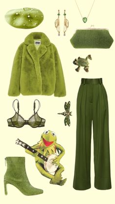 a green outfit and accessories are arranged in the shape of an animal, frog, fish, turtle