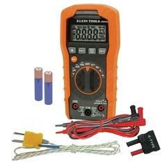 an orange and black digital multimeter with three wires, two plugs and other tools