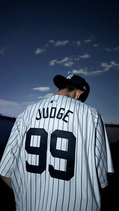 a baseball player wearing a jersey with the number 99 on it's chest and back