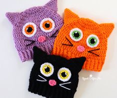 three crocheted hats with cats on them