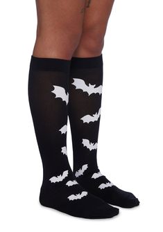 These knee high socks have a stretchy knit construction with printed bats on the front and solid cuffs. Stretch Knee-high Hosiery For Halloween, Black Knee-high Socks For Cosplay, Halloween Knee-high Socks For Stocking Stuffer, Halloween Knee-high Stockings, Pastel Goth Knee High Socks, Halloween Thigh-high Fitted Socks, Black Fitted Knee-high Socks For Halloween, Festival Shop, Costume Store