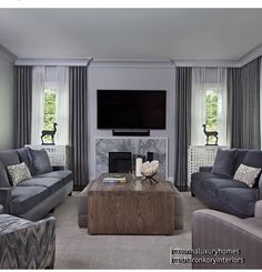 a living room filled with furniture and a flat screen tv mounted on the wall above a fireplace