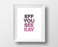 the words eff you see kay are displayed in a white frame on a wall