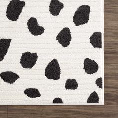 a rug with black and white spots on it