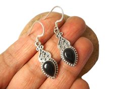 A smart pair of teardrop shaped Black Onyx earrings set in a stylish Sterling Silver design.  Size of Earrings: Width - 10 mm; Total Length - 38 mm. Weight: 5.0 g.  Size of Onyx: 7 x 9 mm. Onyx is the gemstone for the months of January, June and August.  Onyx is used to mark a 7th and 10th wedding anniversary.  Onyx is a soothing stone said to help alleviate fears and worries and to help you to feel comfortable within yourself and in your surroundings. It is also believed to promote stamina and 10th Wedding Anniversary, Black Onyx Earrings, Silver Design, Onyx Earrings, Drop Dangle Earrings, Etsy Earrings Dangle, Fantastic Gifts, Earrings Set, Black Onyx