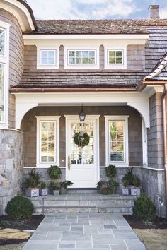 a house with stone steps and white doors