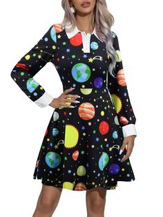 a woman in a black dress with planets on it